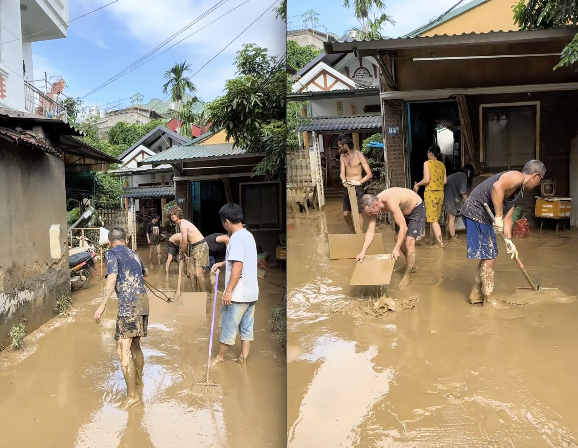 Người dân chèo thuyền giữa dòng nước lũ