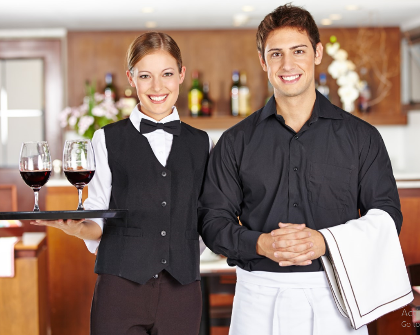 Restaurant staff serving a table